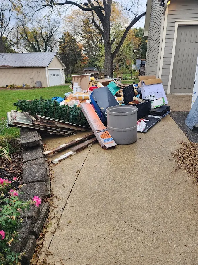 Dumpster being loaded with debris for Demolition Dumpster Rental in Jefferson